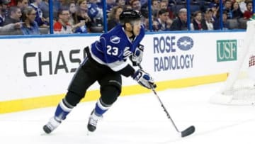 Dec 28, 2013; Tampa, FL, USA;Tampa Bay Lightning right wing J.T. Brown (23) skates with the puck against the Montreal Canadiens during the first period at Tampa Bay Times Forum. Mandatory Credit: Kim Klement-USA TODAY Sports