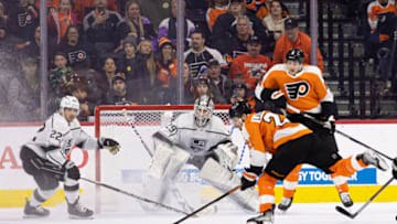 Jan 24, 2023; Philadelphia, Pennsylvania, USA; Philadelphia Flyers center Scott Laughton (21) shoots the puck in front of Los Angeles Kings goaltender Pheonix Copley (29) and left wing Kevin Fiala (22) during the overtime period at Wells Fargo Center. Mandatory Credit: Bill Streicher-USA TODAY Sports