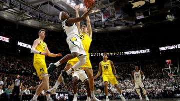 EAST LANSING, MICHIGAN - JANUARY 05: Cassius Winston #5 of the Michigan State Spartans gets to the basket past Franz Wagner #21 of the Michigan Wolverines during the first half at Breslin Center on January 05, 2020 in East Lansing, Michigan. (Photo by Gregory Shamus/Getty Images)