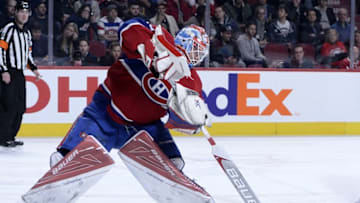 Apr 5, 2016; Montreal, Quebec, CAN; Montreal Canadiens goalie Mike Condon (39) plays the puck during the third period against the Montreal Canadiens at the Bell Centre. Mandatory Credit: Eric Bolte-USA TODAY Sports