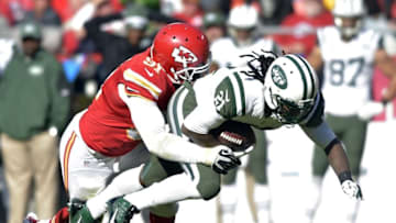 Nov 2, 2014; Kansas City, MO, USA; New York Jets running back Chris Johnson (21) is tackled by Kansas City Chiefs outside linebacker Tamba Hali (91) during the second half at Arrowhead Stadium. The Chiefs won 24-10. Mandatory Credit: Denny Medley-USA TODAY Sports