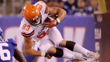 EAST RUTHERFORD, NJ - AUGUST 09: Devon Cajuste #83 of the Cleveland Browns tries to leap over Calvin Munson #46 of the New York Giants in the fourth quarter during their preseason game on August 9,2018 at MetLife Stadium in East Rutherford, New Jersey. (Photo by Elsa/Getty Images)
