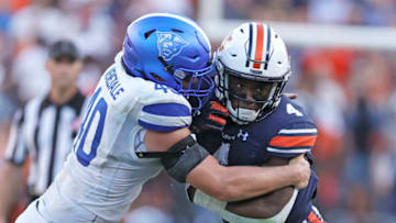 Auburn footballSep 25, 2021; Auburn, Alabama, USA; Georgia State Panthers linebacker Jordan Veneziale (40) stops Auburn Tigers running back Tank Bigsby (4) during the fourth quarter at Jordan-Hare Stadium. Mandatory Credit: John Reed-USA TODAY Sports