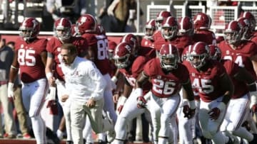 Nov 15, 2014; Tuscaloosa, AL, USA; Alabama Crimson Tide head coach Nick Saban leads his team out on the field for warm-ups prior to facing the Mississippi State Bulldogs at Bryant-Denny Stadium. Mandatory Credit: John David Mercer-USA TODAY Sports