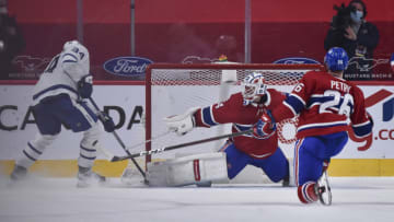 MONTREAL, QC - MAY 03: Goaltender Jake Allen #34 of the Montreal Canadiens stretches out the right pad to make a save on Auston Matthews #34 of the Toronto Maple Leafs in overtime at the Bell Centre on May 3, 2021 in Montreal, Canada. The Montreal Canadiens defeated the Toronto Maple Leafs 3-2 in overtime. (Photo by Minas Panagiotakis/Getty Images)