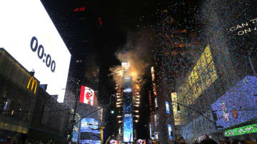 NEW YORK, NEW YORK - JANUARY 01: Confetti fall as the ball drops over Times Square during the 2022 New Year’s Eve celebrations on January 01, 2022 in New York City. Despite a major surge in Covid -19 cases in New York City and across the country, the city held a scaled-down celebration for the annual ball drop. This year, a maximum of 15,000 people will be in attendance, down from approximately 60,000, and proof of vaccination and protective masks are required. (Photo by John Lamparski/Getty Images)