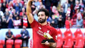 LIVERPOOL, ENGLAND - MAY 13: Mohamed Salah of Liverpool celebrates after receiving his Premier League Golden Boot Award after the Premier League match between Liverpool and Brighton and Hove Albion at Anfield on May 13, 2018 in Liverpool, England. (Photo by Michael Regan/Getty Images)