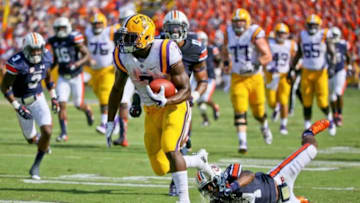 Sep 19, 2015; Baton Rouge, LA, USA; LSU Tigers running back Leonard Fournette (7) breaks away from Auburn Tigers cornerback Ed Paris (24) for a touchdown during the second quarter of a game at Tiger Stadium. Mandatory Credit: Derick E. Hingle-USA TODAY Sports