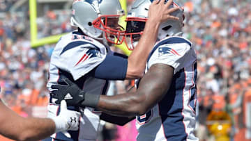 Oct 9, 2016; Cleveland, OH, USA; New England Patriots quarterback Tom Brady (12) and tight end Martellus Bennett (88) celebrate a touchdown during the first quarter against the Cleveland Browns at FirstEnergy Stadium. Mandatory Credit: Ken Blaze-USA TODAY Sports