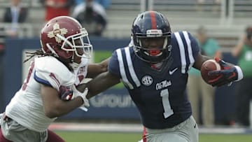 Oct 10, 2015; Oxford, MS, USA; Mississippi Rebels wide receiver Laquon Treadwell (1) carries the ball against New Mexico State Aggies defensive back Lewis Hill (29) during the game at Vaught-Hemingway Stadium. Mandatory Credit: Justin Ford-USA TODAY Sports