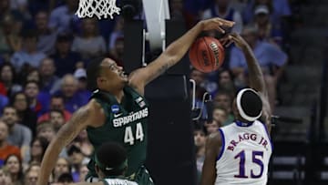 TULSA, OK - MARCH 19: Carlton Bragg Jr. #15 of the Kansas Jayhawks is defended by Nick Ward #44 of the Michigan State Spartans during the second round of the 2017 NCAA Men's Basketball Tournament at BOK Center on March 19, 2017 in Tulsa, Oklahoma. (Photo by Ronald Martinez/Getty Images)