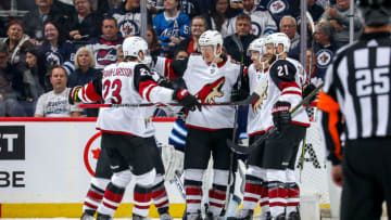 WINNIPEG, MB - OCTOBER 15: Oliver Ekman-Larsson #23, Phil Kessel #81, Christian Dvorak #18, Clayton Keller #9 and Derek Stepan #21 of the Arizona Coyotes celebrate a second period goal against the Winnipeg Jets at the Bell MTS Place on October 15, 2019 in Winnipeg, Manitoba, Canada. (Photo by Jonathan Kozub/NHLI via Getty Images)
