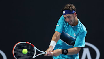 MELBOURNE, AUSTRALIA - JANUARY 21: Cameron Norrie of Great Britain plays a backhand during his Men's Singles first round match against Pierre-Hugues Herbert of France on day two of the 2020 Australian Open at Melbourne Park on January 21, 2020 in Melbourne, Australia. (Photo by Clive Brunskill/Getty Images)