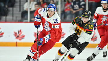 HALIFAX, CANADA - DECEMBER 31: Jiri Kulich #25 of Team Czechia skates the puck against Nikolaus Heigl #13 of Team Germany during the first period in the 2023 IIHF World Junior Championship at Scotiabank Centre on December 31, 2022 in Halifax, Nova Scotia, Canada. (Photo by Minas Panagiotakis/Getty Images)