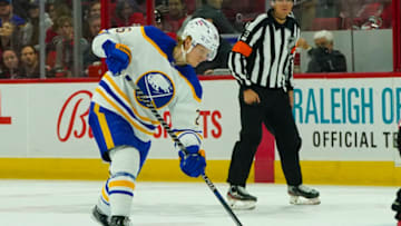 Apr 7, 2022; Raleigh, North Carolina, USA; Buffalo Sabres defenseman Rasmus Dahlin (26) takes a shot against the Carolina Hurricanes during the second period at PNC Arena. Mandatory Credit: James Guillory-USA TODAY Sports