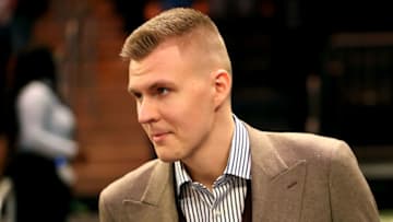 NEW YORK, NY - MARCH 13: Kristaps Porzingis #6 of the New York Knicks is welcomed back after tearing his ACL previously in the season prior to taking on the Dallas Mavericks during their game at Madison Square Garden on March 13, 2018 in New York City. (Photo by Abbie Parr/Getty Images)