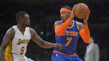 December 11, 2016; Los Angeles, CA, USA; New York Knicks forward Carmelo Anthony (7) controls the ball against the defense of Los Angeles Lakers forward Luol Deng (9) during the first half at Staples Center. Mandatory Credit: Gary A. Vasquez-USA TODAY Sports