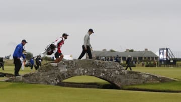 Jul 20, 2015; St. Andrews, Fife, SCT; Jordan Speith walks over the Swilcan Bridge on the 18th hole during the final round of the 144th Open Championship at St. Andrews - Old Course. Mandatory Credit: Brian Spurlock-USA TODAY Sports