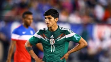 Apr 2, 2014; Glendale, AZ, USA; Mexico forward Alan Pulido (11) against USA during a friendly match at University of Phoenix Stadium. The game ended in a 2-2 tie. Mandatory Credit: Mark J. Rebilas-USA TODAY Sports