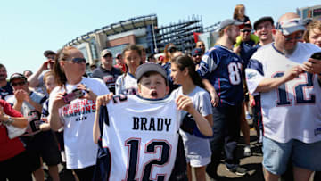 FOXBORO, MA - MAY 24: Liam McIntyre, 12 of West Roxbury, MA shows his support for New England Patriots quarterback Tom Brady at the "Free Tom Brady" rally at Gillette Stadium on May 24, 2015 in Foxboro, Massachusetts. The rally was held in protest of Brady's four game suspension for his role in the "deflategate" scandal. (Photo by Maddie Meyer/Getty Images)