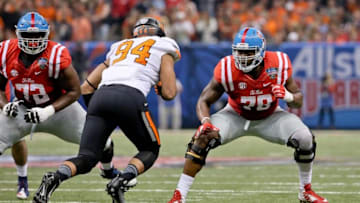 Jan 1, 2016; New Orleans, LA, USA; Mississippi Rebels offensive lineman Laremy Tunsil (78) blocks Oklahoma State Cowboys defensive end Jordan Brailford (94) during the second quarter in the 2016 Sugar Bowl at the Mercedes-Benz Superdome. Mandatory Credit: Derick E. Hingle-USA TODAY Sports