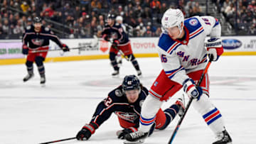 Nov 13, 2021; Columbus, Ohio, USA; Columbus Blue Jackets center Alexandre Texier (42) reaches for the puck against New York Rangers center Ryan Strome (16) on a partial breakaway in the third period at Nationwide Arena. Mandatory Credit: Gaelen Morse-USA TODAY Sports