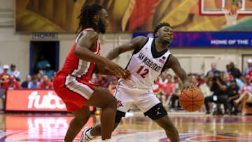 LAHAINA, HI - NOVEMBER 21: Darrion Trammell #12 of the San Diego State Aztecs reacts after getting fouled by Bruce Thornton #2 of the Ohio State Buckeyes in the first half of the game during the Maui Invitational at Lahaina Civic Center on November 21, 2022 in Lahaina, Hawaii. (Photo by Darryl Oumi/Getty Images)