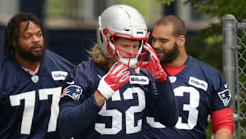 FOXBOROUGH, MA - JUNE 5: New England Patriots' Chase Winovich (52) adjusts his helmet as he heads into Patriots minicamp at Gillette Stadium in Foxborough, MA on June 5, 2019. (Photo by Jonathan Wiggs/The Boston Globe via Getty Images)