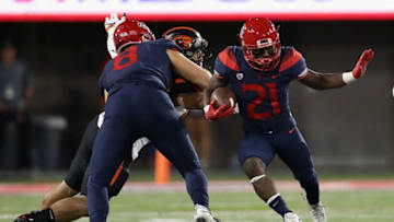 TUCSON, AZ - NOVEMBER 11: Running back J.J. Taylor #21 of the Arizona Wildcats rushes the football against the Oregon State Beavers during the second half of the college football game at Arizona Stadium on November 11, 2017 in Tucson, Arizona. (Photo by Christian Petersen/Getty Images)