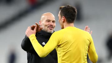 LONDON, ENGLAND - DECEMBER 09: Freddie Ljungberg, Interim Manager of Arsenal and Mesut Ozil of Arsenal celebrate victory during the Premier League match between West Ham United and Arsenal FC at London Stadium on December 09, 2019 in London, United Kingdom. (Photo by Julian Finney/Getty Images)