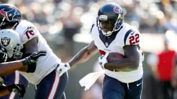 Sep 14, 2014; Oakland, CA, USA; Houston Texans running back Ronnie Brown (22) runs the ball against the Oakland Raiders in the fourth quarter at O.co Coliseum. The Texans defeated the Raiders 30-14. Mandatory Credit: Cary Edmondson-USA TODAY Sports
