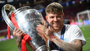 MADRID, SPAIN - JUNE 01: Alberto Moreno of Liverpool celebrates with the Champions League Trophy after winning the UEFA Champions League Final between Tottenham Hotspur and Liverpool at Estadio Wanda Metropolitano on June 01, 2019 in Madrid, Spain. (Photo by Matthias Hangst/Getty Images)
