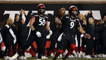 Dylan O'Quinn and Desmond Ridder celebrate a Bearcats touchdown. Getty Images.