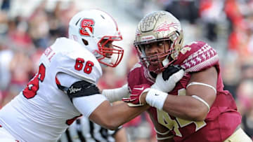 Nov 14, 2015; Tallahassee, FL, USA; Florida State Seminoles defensive end Demarcus Walker (44) battles at the line against North Carolina State Wolfpack offensive tackle Will Richardson (66) during the second half of the game at Doak Campbell Stadium. Mandatory Credit: Melina Vastola-USA TODAY Sports