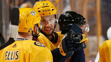 NASHVILLE, TN - MARCH 29: Nick Bonino #13 talks with Ryan Ellis #4 of the Nashville Predators as the waits for play to begin against the San Jose Sharks during an NHL game at Bridgestone Arena on March 29, 2018 in Nashville, Tennessee. (Photo by John Russell/NHLI via Getty Images)
