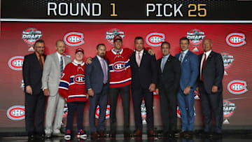 CHICAGO, IL - JUNE 23: (L-R) Assistant general manager Rick Dudley, Bill Berglund, draft runner Jake Timmins, VP of player personnel Trevor Timmins, 25th overall pick Ryan Poehling, director of amateur scouting Shane Churla, owner/president Geoff Molson, executive VP of and general manager Marc Bergevin and head coach Claude Julien of the Montreal Canadiens pose for a photo onstage during Round One of the 2017 NHL Draft at United Center on June 23, 2017 in Chicago, Illinois. (Photo by Dave Sandford/NHLI via Getty Images)