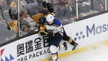 BOSTON, MA - MAY 29: St. Louis Blues center Oskar Sundqvist (70) puts Boston Bruins left defenseman Matt Grzelcyk (48) out of the game during Game 2 of the 2019 Stanley Cup Finals between the Boston Bruins and the St. Louis Blues on May 29, 2019, at TD Garden in Boston, Massachusetts. (Photo by Fred Kfoury III/Icon Sportswire via Getty Images)
