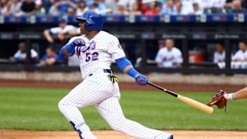 Jul 7, 2016; New York City, NY, USA; New York Mets center fielder Yoenis Cespedes (52) hits a single against the Washington Nationals during the first inning at Citi Field. Mandatory Credit: Brad Penner-USA TODAY Sports