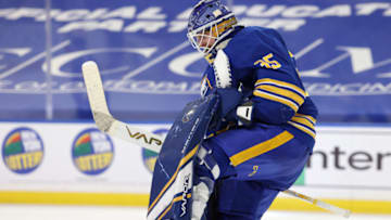 Apr 3, 2021; Buffalo, New York, USA; Buffalo Sabres goaltender Linus Ullmark (35) celebrates after a win in a shootout against the New York Rangers at KeyBank Center. Mandatory Credit: Timothy T. Ludwig-USA TODAY Sports