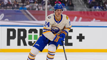 Mar 13, 2022; Hamilton, Ontario, CAN; Buffalo Sabres forward Dylan Cozens (24) skates against the Toronto Maple Leafs in the 2022 Heritage Classic ice hockey game at Tim Hortons Field. Mandatory Credit: John E. Sokolowski-USA TODAY Sports