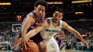 Josh Childress #1 of the Phoenix Suns fights for a ball with Greivis Vasquez #21 of the New Orleans Hornets at New Orleans Arena on December 30, 2011 in New Orleans, Louisiana. NOTE TO USER: User expressly acknowledges and agrees that, by downloading and or using this photograph, User is consenting to the terms and conditions of the Getty Images License Agreement. (Photo by Chris Graythen/Getty Images)