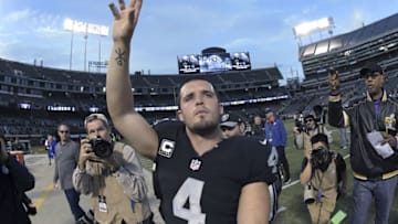 Dec 4, 2016; Oakland, CA, USA; Oakland Raiders quarterback Derek Carr (4) celebrates after NFL football game against the Buffalo Bills at Oakland Coliseum. The Raiders defeated the Bills 38-24. Mandatory Credit: Kirby Lee-USA TODAY Sports