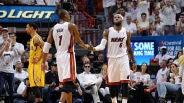 May 30, 2014; Miami, FL, USA; Miami Heat center Chris Bosh (1) celebrates with forward LeBron James (6) during the second half in game six of the Eastern Conference Finals of the 2014 NBA Playoffs against the Indiana Pacers at American Airlines Arena. Mandatory Credit: Steve Mitchell-USA TODAY Sports
