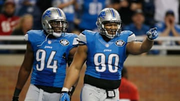 DETROIT, MI - DECEMBER 07: Ndamukong Suh #90 and Ezekiel Ansah #94 of the Detroit Lions celebrates a fourth quarter sack while playing the Tampa Bay Buccaneers at Ford Field on December 07, 2014 in Detroit, Michigan. Detroit won the game 34-17. (Photo by Gregory Shamus/Getty Images)