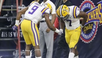 Dec 29, 2015; Houston, TX, USA; LSU Tigers running back Leonard Fournette (7) celebrates with wide receiver John Diarse (9) after scoring a touchdown against the Texas Tech Red Raiders in the second half at NRG Stadium. The Tigers won 56-27. Mandatory Credit: Thomas B. Shea-USA TODAY Sports