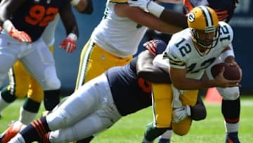 Sep 13, 2015; Chicago, IL, USA; Chicago Bears defensive tackle Jarvis Jenkins (96) makes a tackle against Green Bay Packers quarterback Aaron Rodgers (12) during the first quarter at Soldier Field. Mandatory Credit: Mike DiNovo-USA TODAY Sports