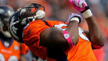 DENVER - OCTOBER 04: Linebacker Robert Ayers #56 of the Denver Broncos celebrates a defensive play against the Dallas Cowboys during NFL action at Invesco Field at Mile High on October 4, 2009 in Denver, Colorado. The Broncos defeated the Cowboys 17-10. (Photo by Doug Pensinger/Getty Images)