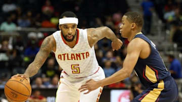 Oct 18, 2016; Atlanta, GA, USA; Atlanta Hawks guard Malcolm Delaney (5) drives against New Orleans Pelicans guard Tim Frazier (2) in the third quarter of their game at Philips Arena. The Hawks won 96-89. Mandatory Credit: Jason Getz-USA TODAY Sports