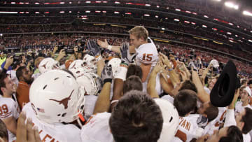 06 December 2009 - Hunter Lawrence (15) of the Texas Longhorns is mobbed by teammates after his 46 yard field goal as time expires during the Texas 13-12 win over Nebraska in the Big 12 Conference championship game at Cowboys Stadium in Arlington, Texas. (Photo by James D. Smith/Icon SMI/Icon Sport Media via Getty Images)