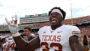 DALLAS, TX - OCTOBER 06: Jeffrey McCulloch #23 of the Texas Longhorns celebrates a win against Oklahoma Sooners in the 2018 AT&T Red River Showdown at Cotton Bowl on October 6, 2018 in Dallas, Texas. (Photo by Ronald Martinez/Getty Images)